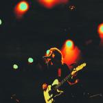 Paolo Nutini playing guitar on stage